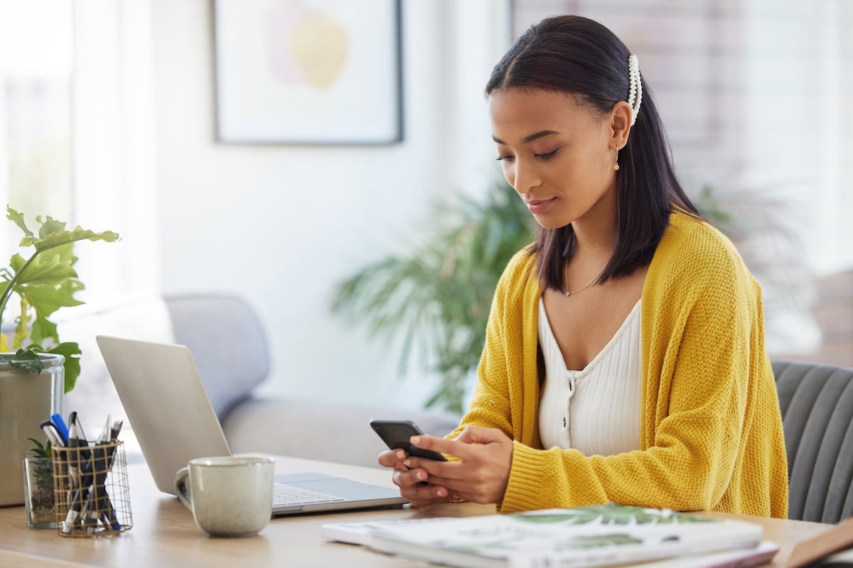 Phone, contact and woman in home typing email for online university application information.