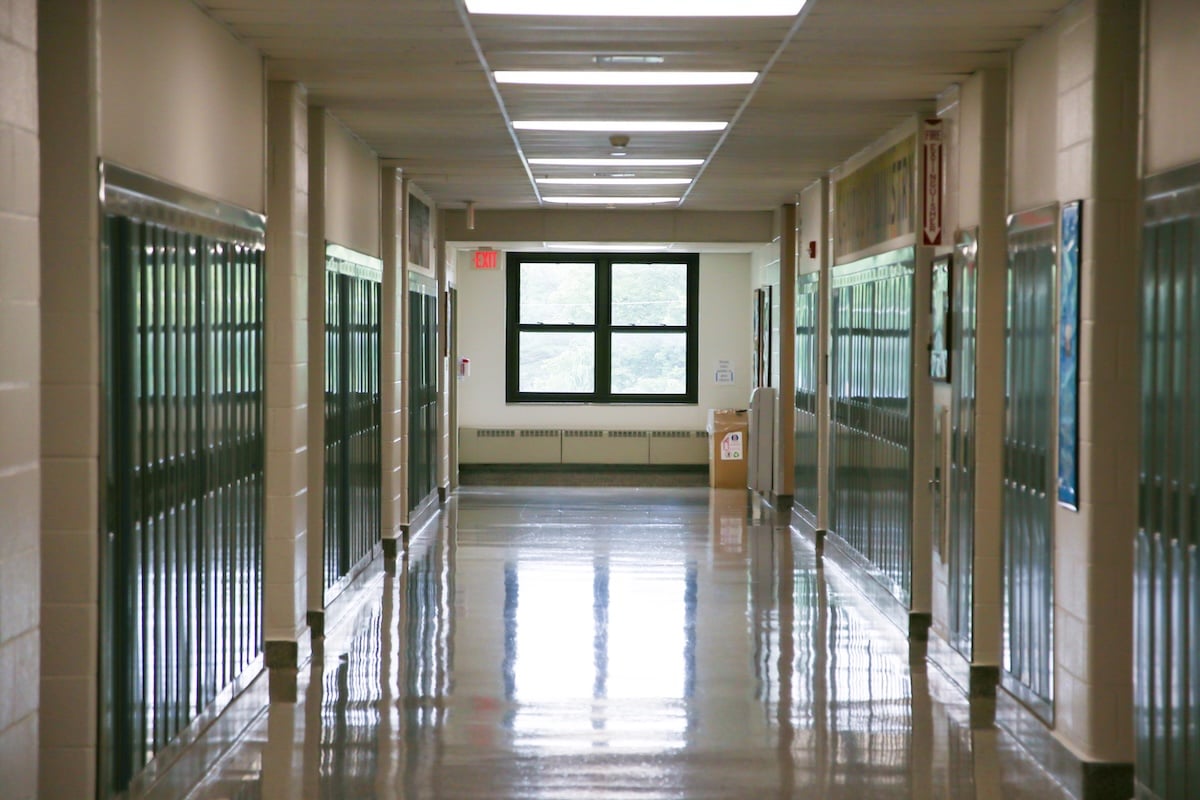 High school hallway representing high school guidance counselor push to college.