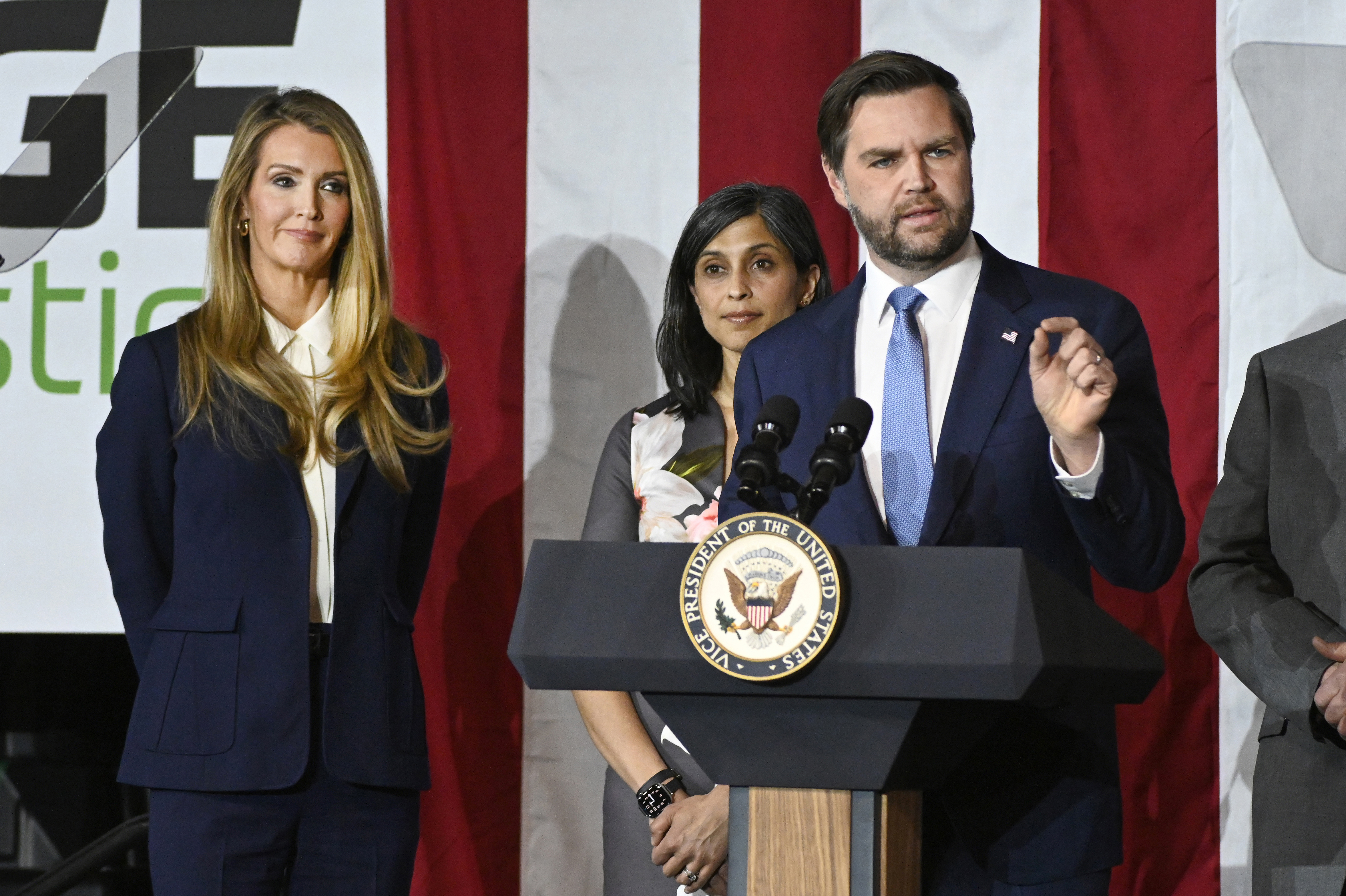 Vans Vice President JD Vance, to the right, speaks in a rally about "Industrial emission in America," It is also surrounded by the Director of Small Business Administration, Kelly Lovler, the far left, and his wife, Usha Vans, Friday, 14 March 2025, at Vantage Plastics in Bay City, Michigan (AP Photo/Jose Joarez)